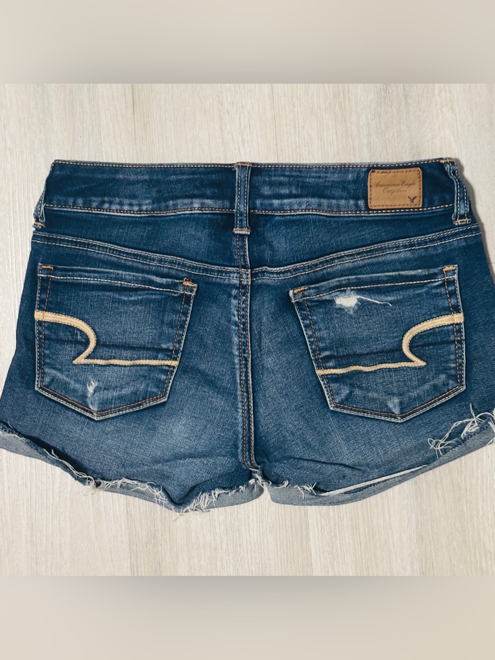 American Eagle stretch low rise distressed dark denim cut off shorts raw hem  2